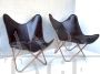 Butterfly style contemporary leather armchairs                            