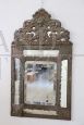 Small antique 19th century mirror in wood and embossed brass