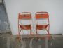 Pair of orange metal garden chairs, 1970s