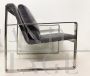 Minimalist design armchairs in metal and dark gray fabric