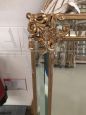 Mirror in gilded wood with flowers, antique style