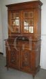 Antique cupboard with glass doors, early 20th century