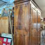 Large antique wardrobe from the early 19th century in walnut with diamond carved doors