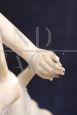 Sculpture of a girl playing tennis in white marble, early decades of the 20th century