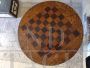 Antique round snap top table with inlaid chessboard, 19th century