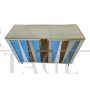 Two-door sideboard with light blue glass and brass geometries