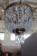 Antique chandelier from the late 19th century in gilded bronze with crystal drops