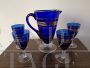 Set of glasses and carafe in blue Murano glass with gold decorations, mid-19th century