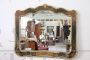 Antique style mirror with shaped and painted wooden frame