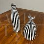 Pair of black and white striped Murano glass vases with flattened shape, 1930s - 1940s