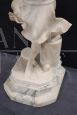 Sculpture of a girl playing tennis in white marble, early decades of the 20th century