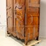 Antique Louis XV wardrobe or cupboard in walnut and cherry with carvings, 18th century