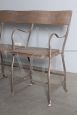 Vintage industrial metal bench with folding seats