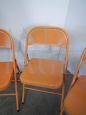 Set of 3 orange metal folding chairs, 1970s