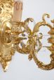 Pair of chiseled gilt bronze wall lights in antique style