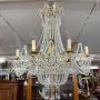 Early 1900s 8-light chandelier in gold metal with crystal drops