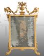 Antique Louis XVI mirror from the 18th century in gilded and carved wood