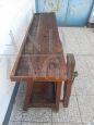 Antique carpenter's bench table from the early 19th century in oak with vice