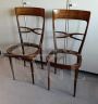 Pair of Melchiorre Bega chairs in green skai leather, 1950s