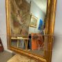 Large antique gilded mirror with a wavy shape