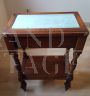 Antique inlaid coffee table with light blue velvet top                