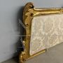 Antique 19th century bed headboard in carved wood with gold leaf