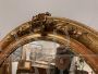 Antique oval mirror from 1840 in gold leaf