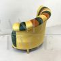 Pair of multicolored round design armchairs with asymmetrical backrest