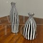 Pair of black and white striped Murano glass vases with flattened shape, 1930s - 1940s