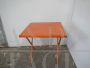 Vintage orange lacquered iron garden table, 1970s