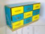 Design chest of drawers with 9 drawers in yellow and blue glass