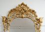 Antique Napoleon III mirror in gilded wood carved with griffins and rocailles