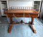 Antique desk in light mahogany with railing on the top