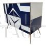 Sideboard with white and blue glass geometries