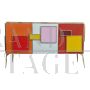 Three-door sideboard in colored glass with backlit handles