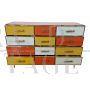 Dresser with 12 drawers in yellow and orange colored glass