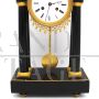 Antique pendulum clock from the Directoire period in gilded bronze and marble