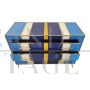 Dresser with 4 drawers covered in blue, white and yellow glass