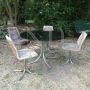 Vintage lounge set with glass and steel table and 4 pony skin chairs, 1970s