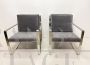 Minimalist design armchairs in metal and dark gray fabric