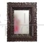 17th century mirror with richly carved wooden frame