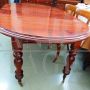 Antique English mahogany extendable dining table