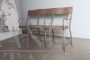 Vintage industrial metal bench with folding seats