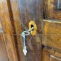 Large antique wardrobe from the early 19th century in walnut with diamond carved doors