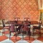 Living room set by Osvaldo Borsani with table and chairs in mahogany and rosewood