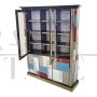 Large bookcase covered in colored glass and illuminated