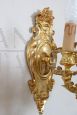 Pair of chiseled gilt bronze wall lights in antique style