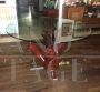 Vintage table with round crystal top on cherry tree trunk and branches