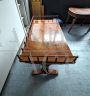 Antique desk in light mahogany with railing on the top