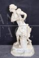 Sculpture of a girl playing tennis in white marble, early decades of the 20th century